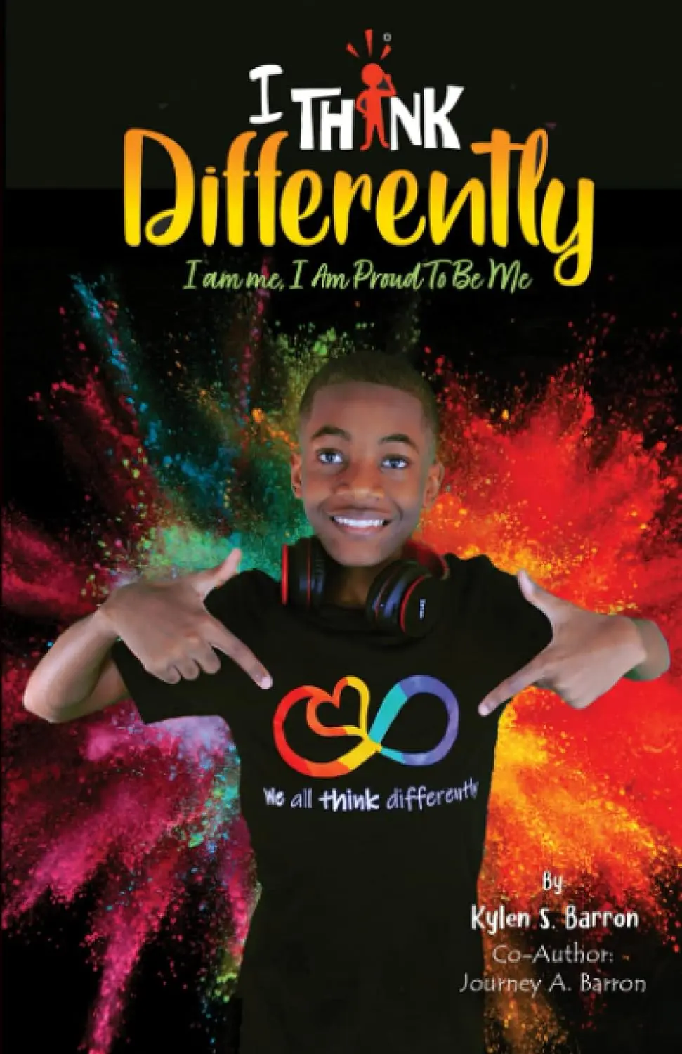 A young boy is wearing headphones and holding his hands out.